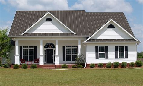 white house with grey metal roof|white house gray metal roof.